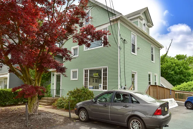 a car parked in front of a house