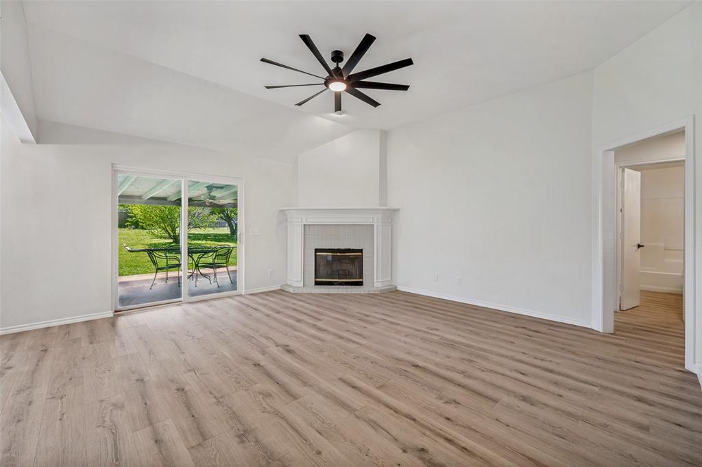 629 Concho Drive Oak Point, TX 75068 - Photo 5 of 35 wooden floor in an empty room with a window