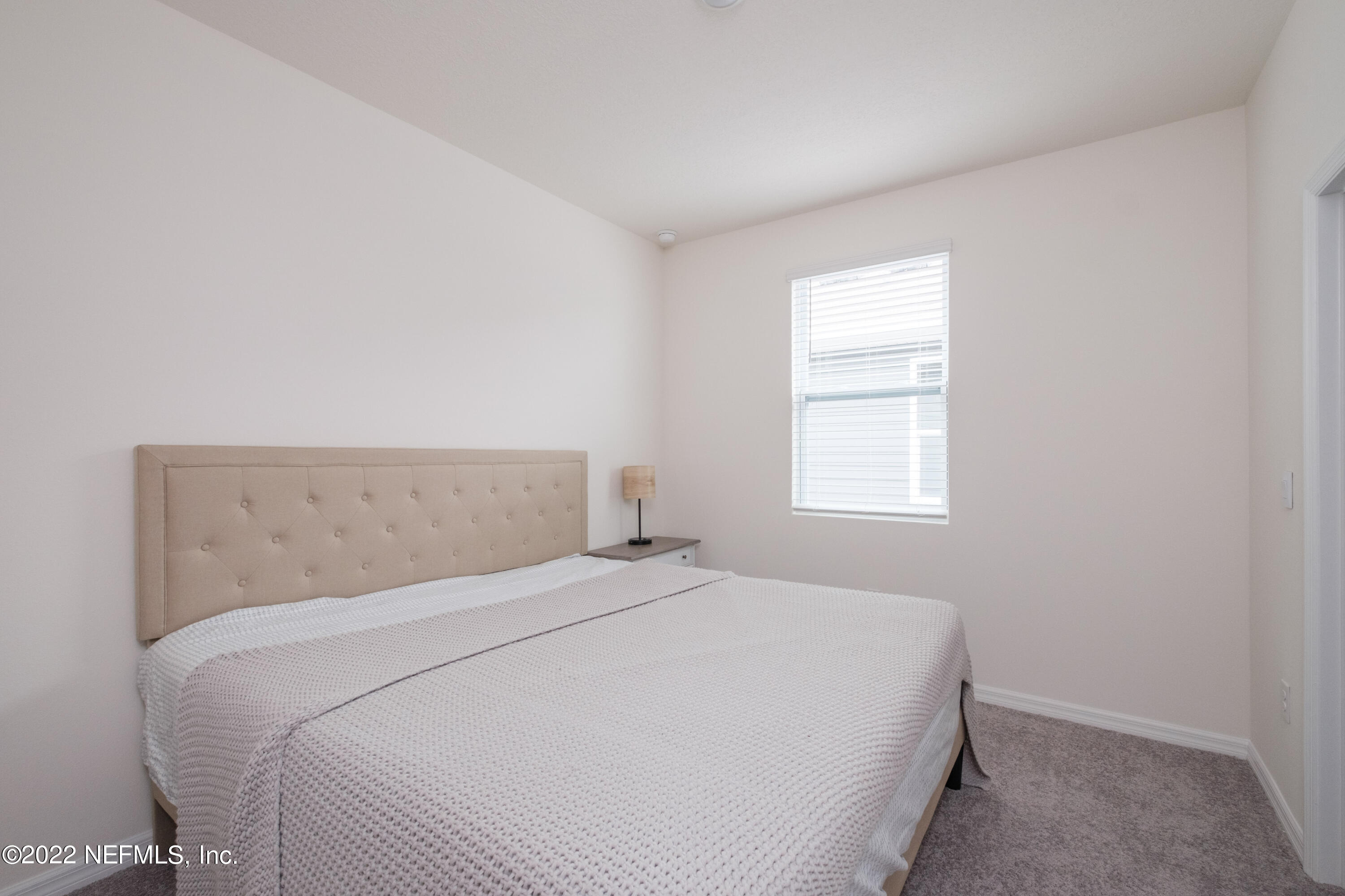 13803 Northwest 9th Road Newberry, FL 32669 - Photo 12 of 21 a bedroom with a bed and a window