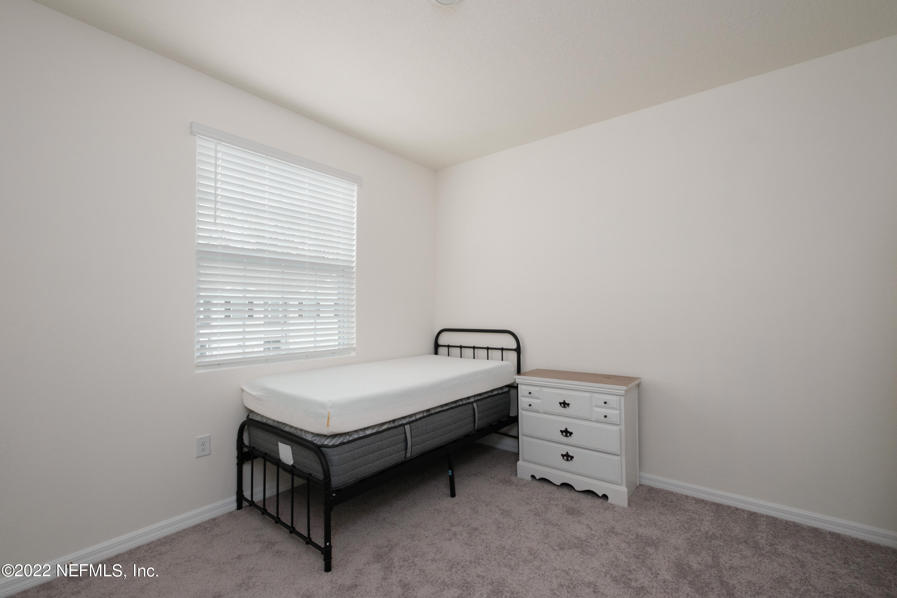 13803 Northwest 9th Road Newberry, FL 32669 - Photo 13 of 21 a room with a bed and a window