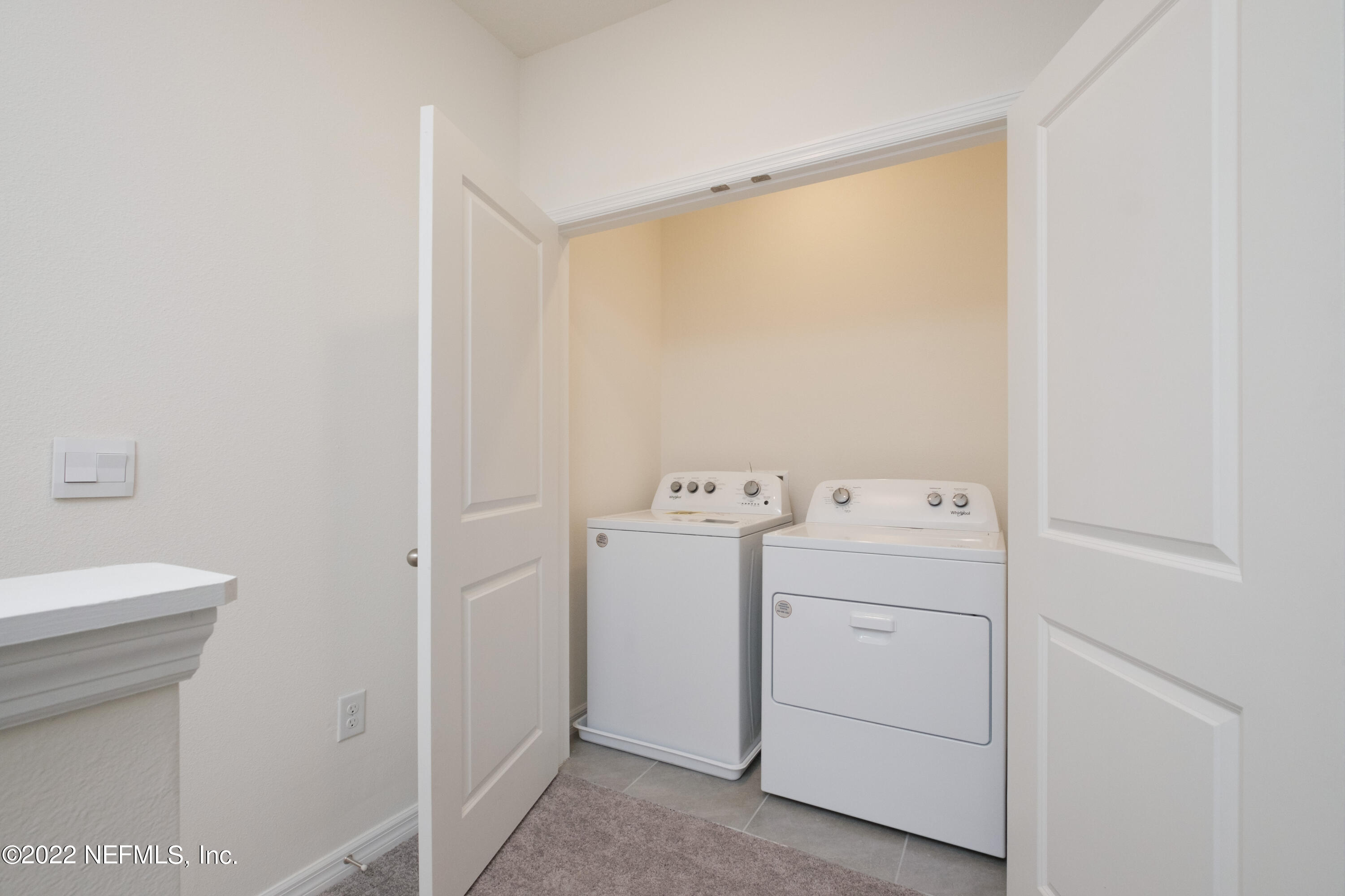 13803 Northwest 9th Road Newberry, FL 32669 - Photo 15 of 21 a utility room with dryer and washer