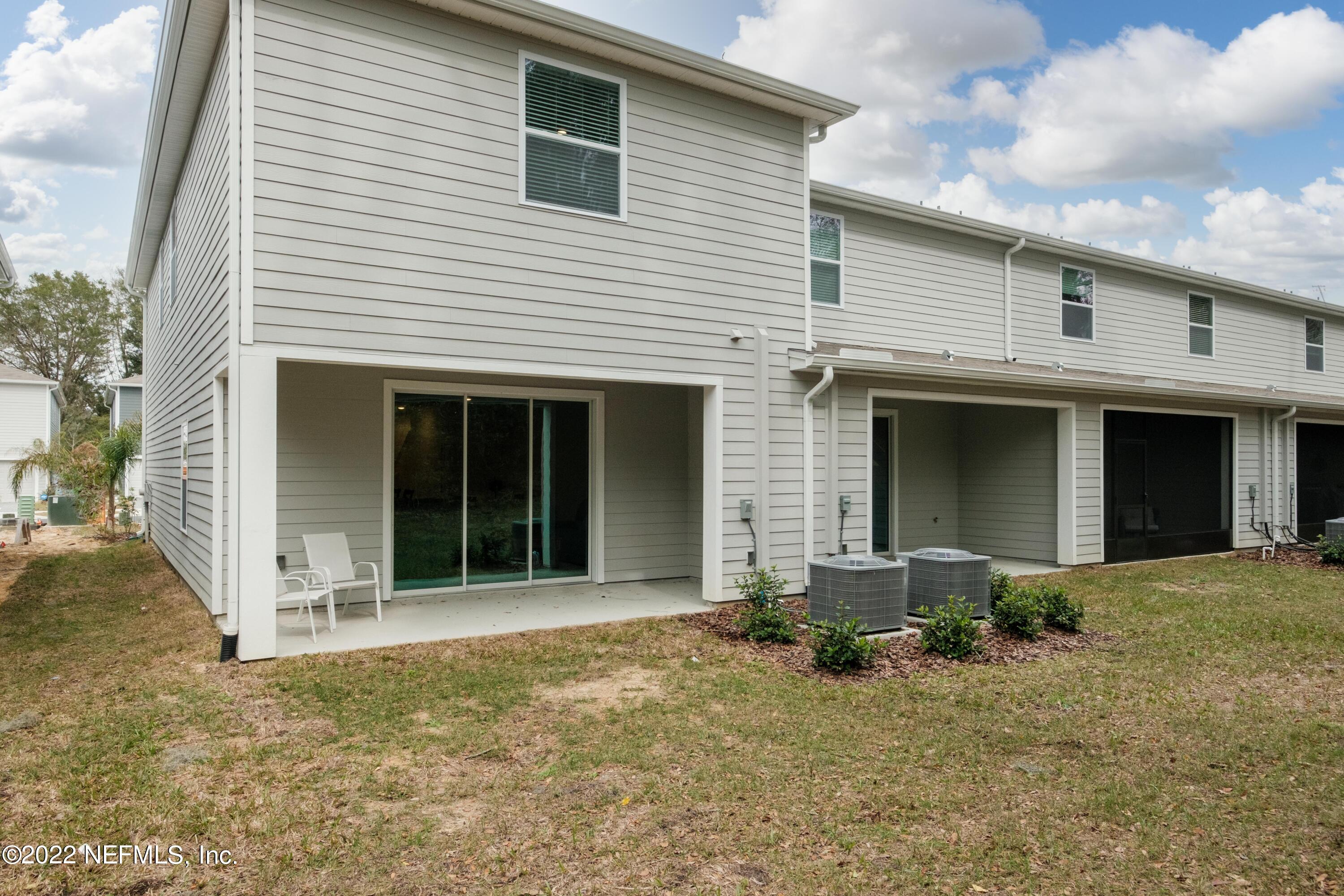 13803 Northwest 9th Road Newberry, FL 32669 - Photo 17 of 21 a front view of a house with a yard