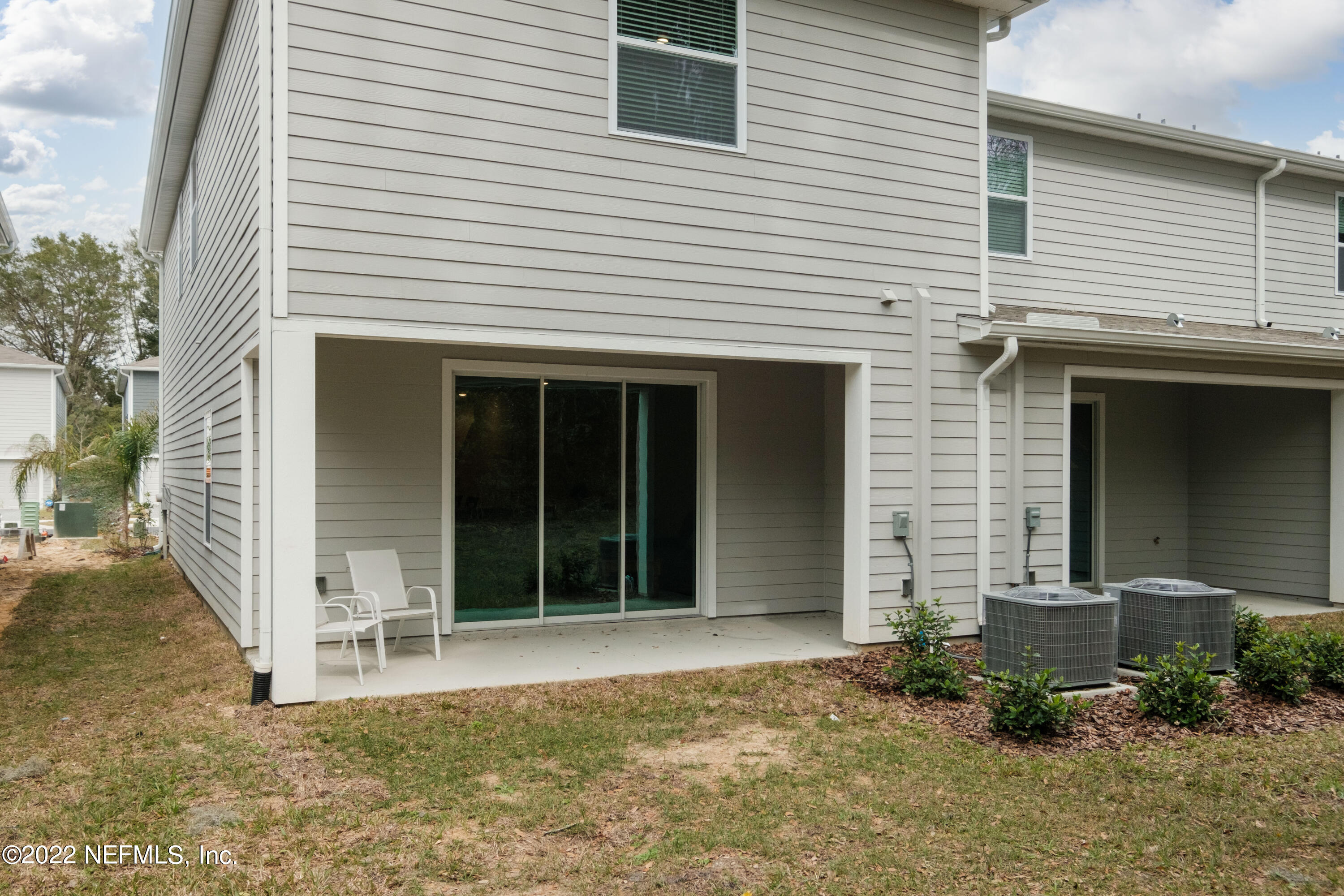 13803 Northwest 9th Road Newberry, FL 32669 - Photo 18 of 21 a front view of a house with a yard