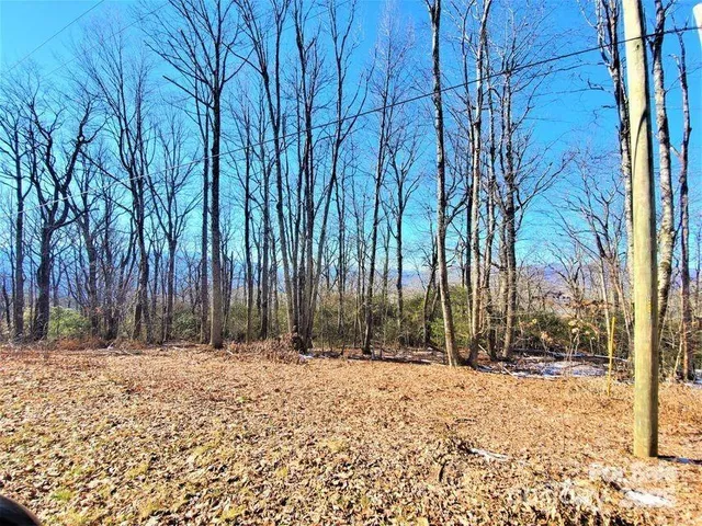 a view of house with snow on the road