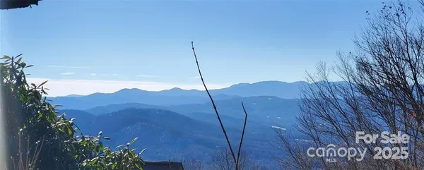 a view of a house with a mountain