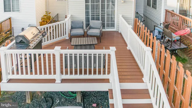 a view of a balcony with furniture