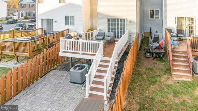 a view of a balcony with couch and wooden floor