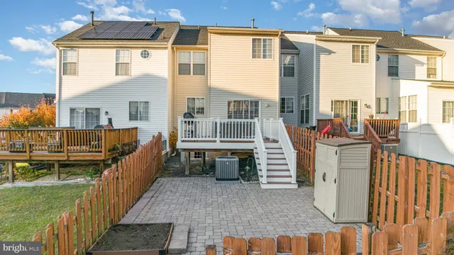a view of a house with backyard and porch
