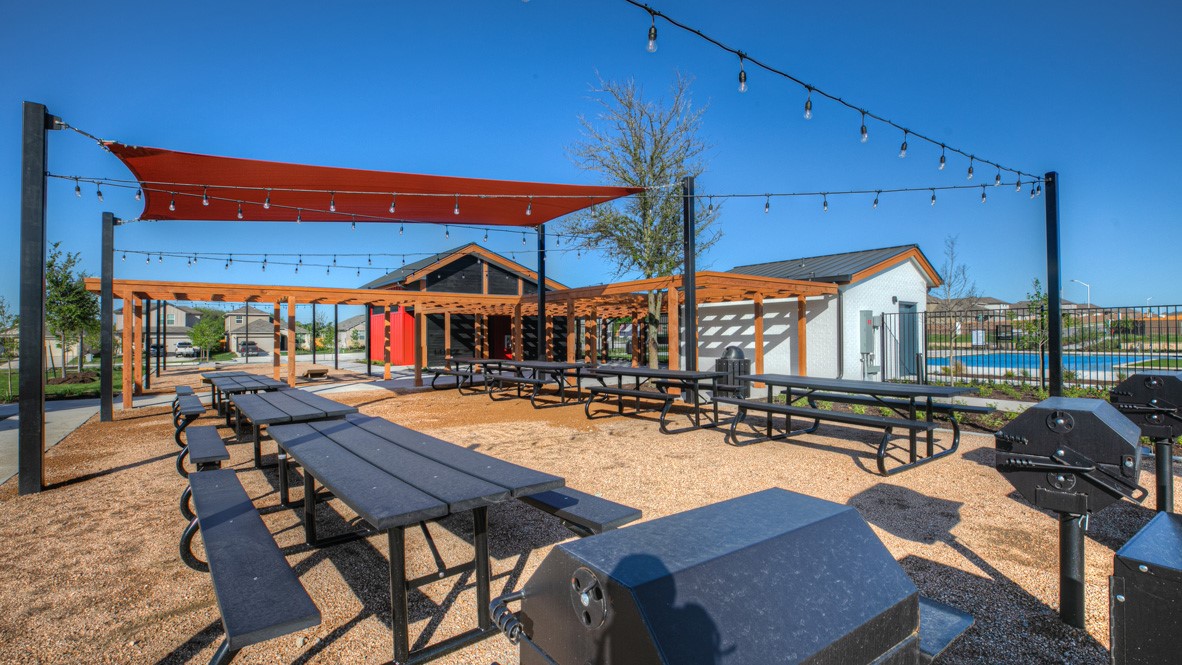 568 Globe Mallow Circle Kyle, TX 78640 - Photo 10 of 21 a patio with a table and chairs under an umbrella