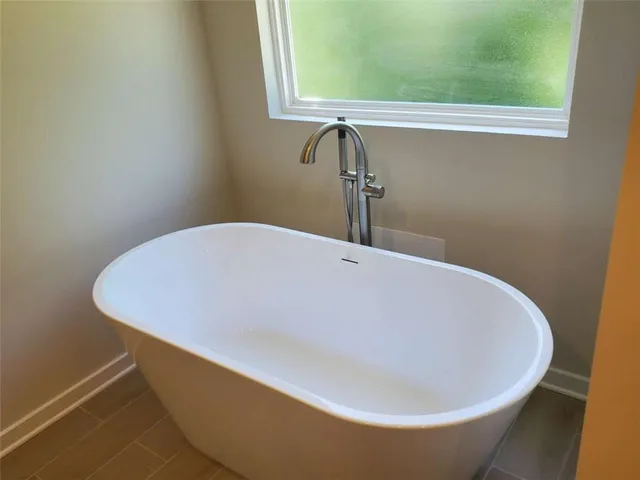 a close up of a bathtub in a bathroom