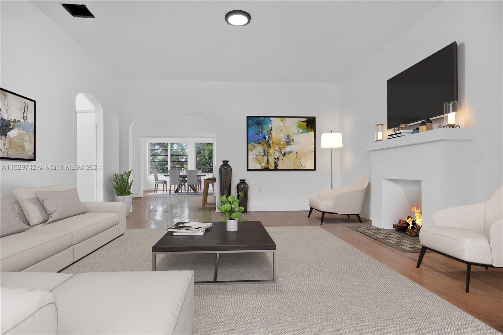 1886 Southwest 16th Terrace Miami, FL 33145 - Photo 1 of 14 a living room with furniture and a flat screen tv
