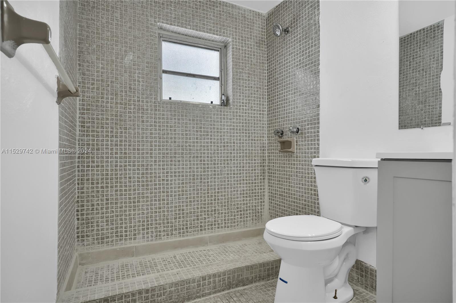 1886 Southwest 16th Terrace Miami, FL 33145 - Photo 12 of 14 a bathroom with a toilet a sink and shower