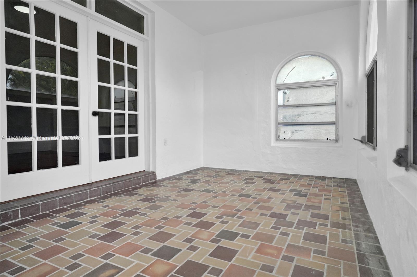 1886 Southwest 16th Terrace Miami, FL 33145 - Photo 6 of 14 a view of an empty room with a window