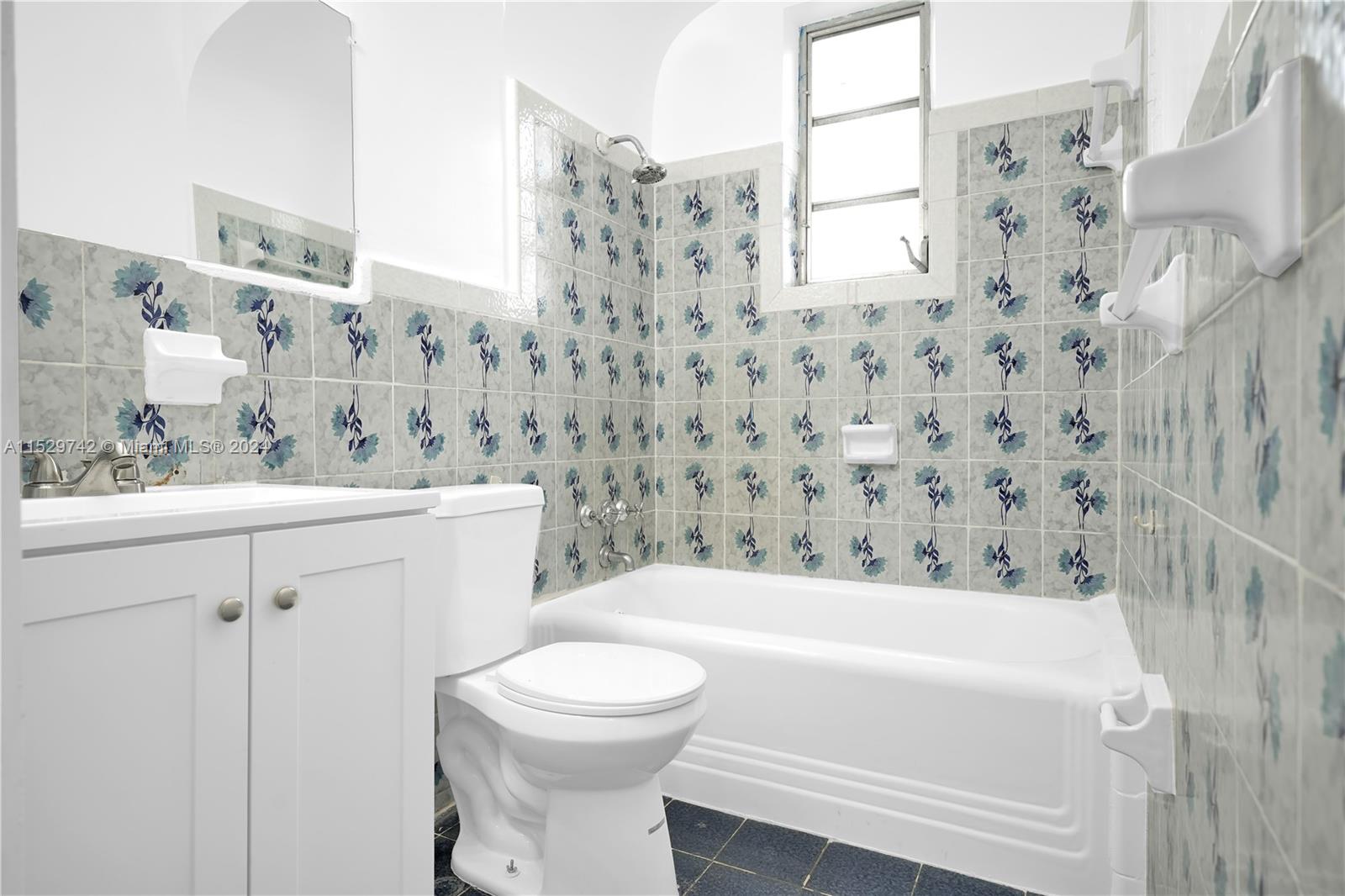 1886 Southwest 16th Terrace Miami, FL 33145 - Photo 9 of 14 a bathroom with a bathtub and sink