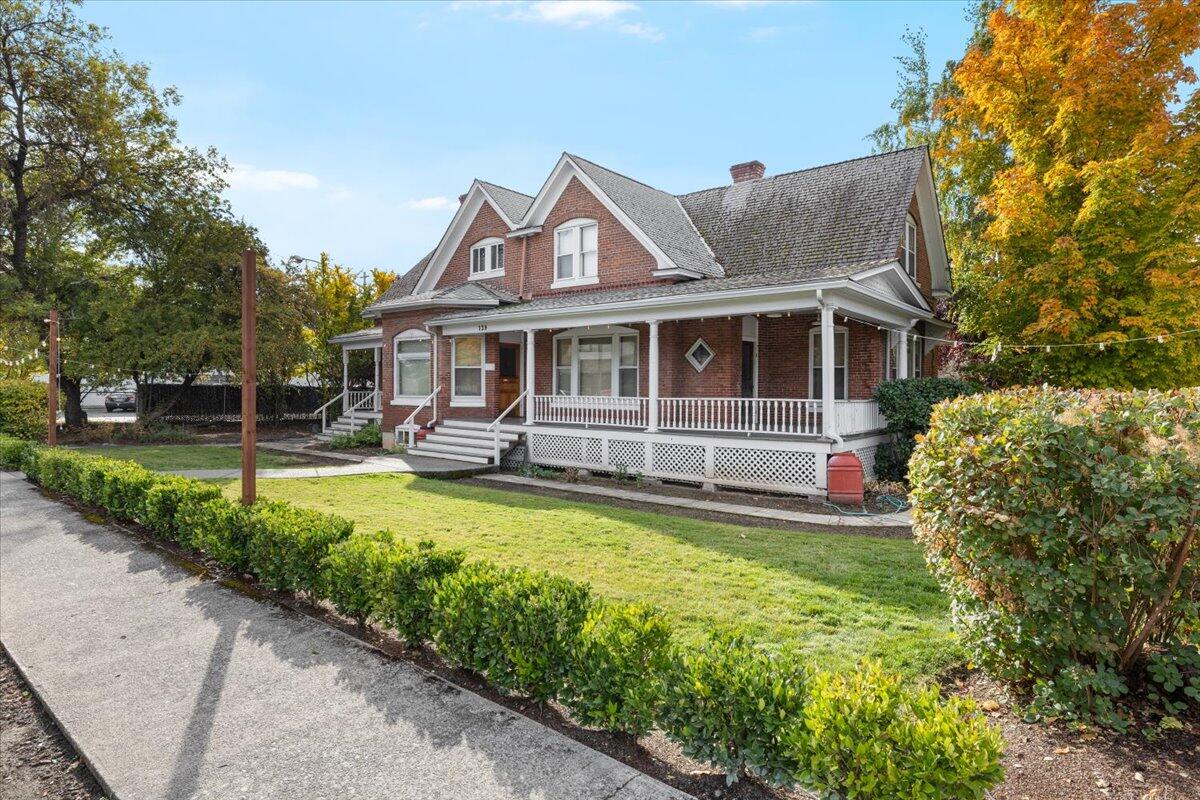 139 Southwest I Street Grants Pass, OR 97526 - Photo 2 of 47 a front view of a house with swimming pool and porch