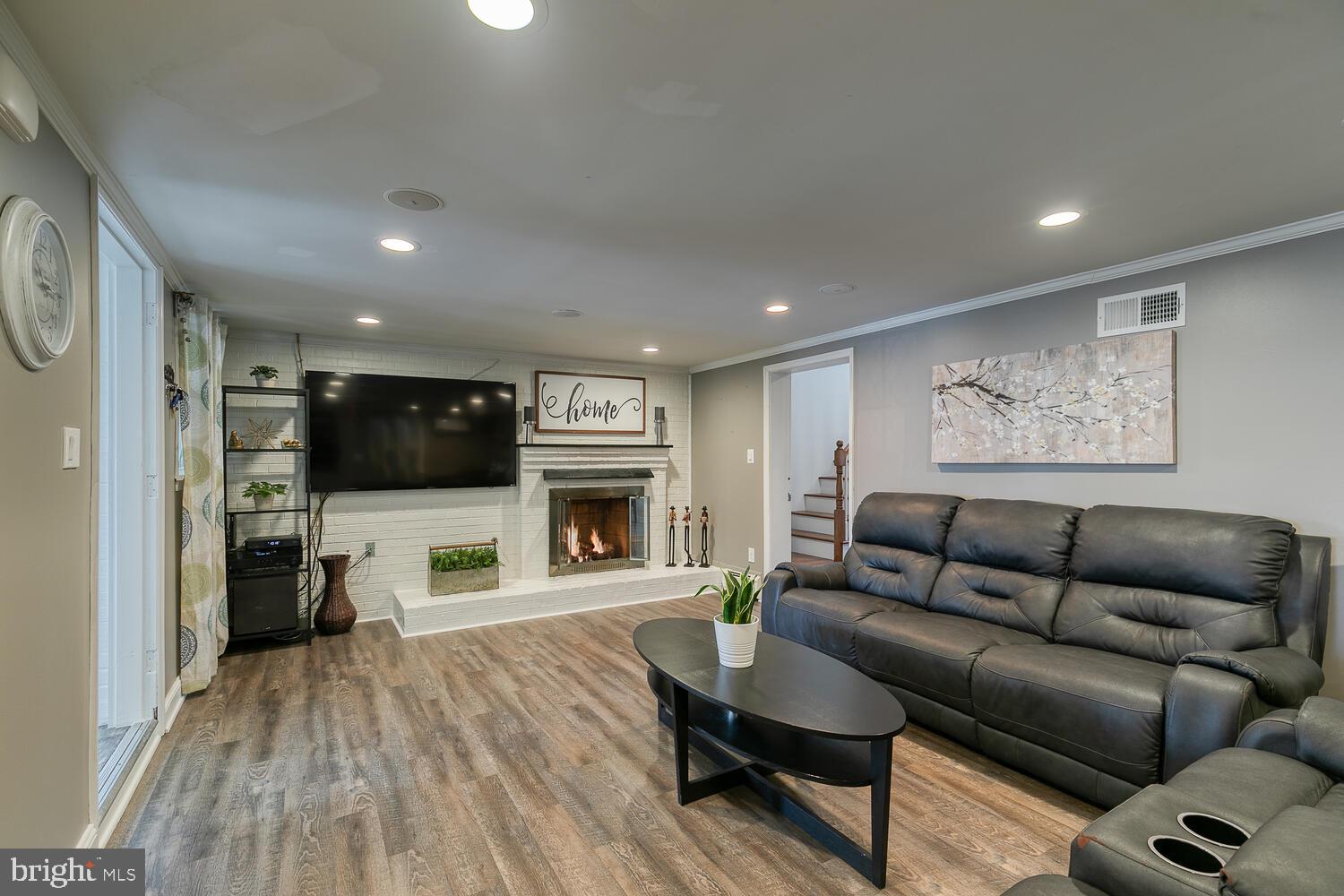 1206 Riggs Court Woodbridge, VA 22191 - Photo 30 of 65 Gas Fireplace with Brick Surround