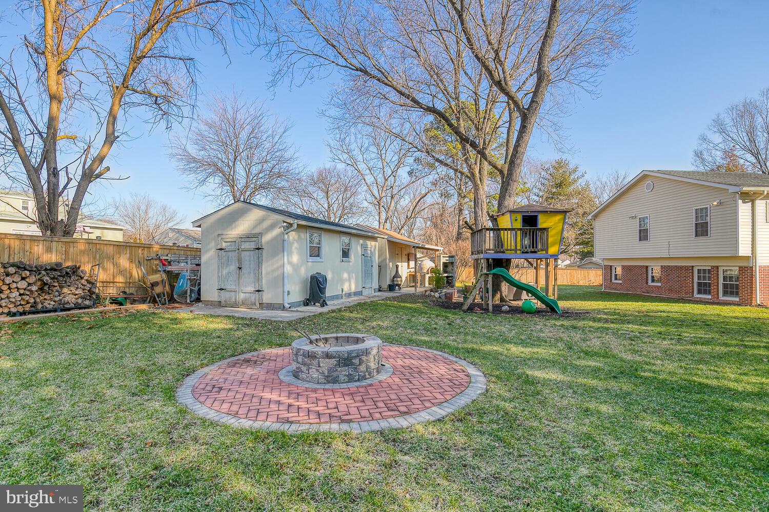 1206 Riggs Court Woodbridge, VA 22191 - Photo 57 of 65 Brick Fire Pit Area andTwo Large Storage Sheds