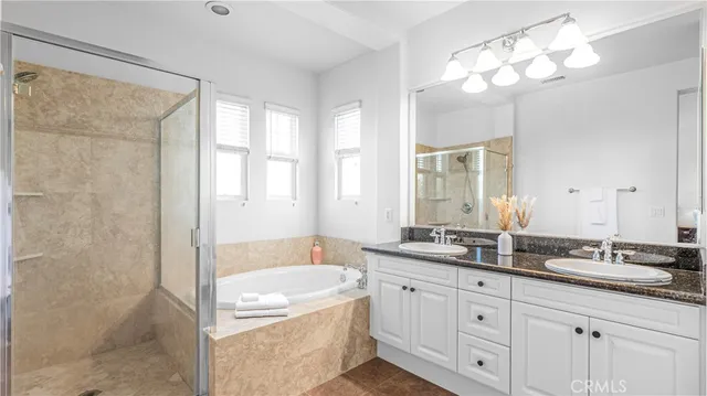 a bedroom with a bed and a potted plant