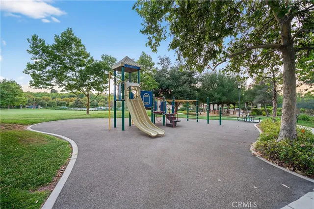 a view of a park with swings and slides