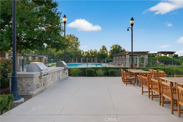 a view of a house with sitting area and swimming pool