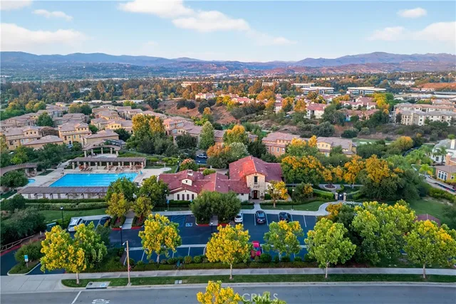 an aerial view of residential house with an outdoor space and seating area