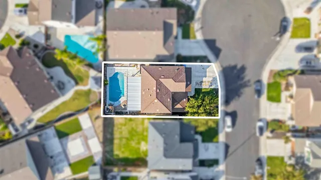 an aerial view of a house with swimming pool