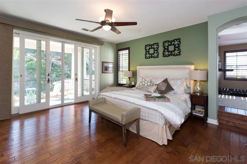 11692 Eastfield Road Poway, CA 92064 - Photo 13 of 25 a bedroom with a large bed and a large window