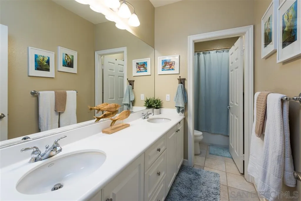 11692 Eastfield Road Poway, CA 92064 - Photo 18 of 25 a bathroom with a sink double vanity and a mirror