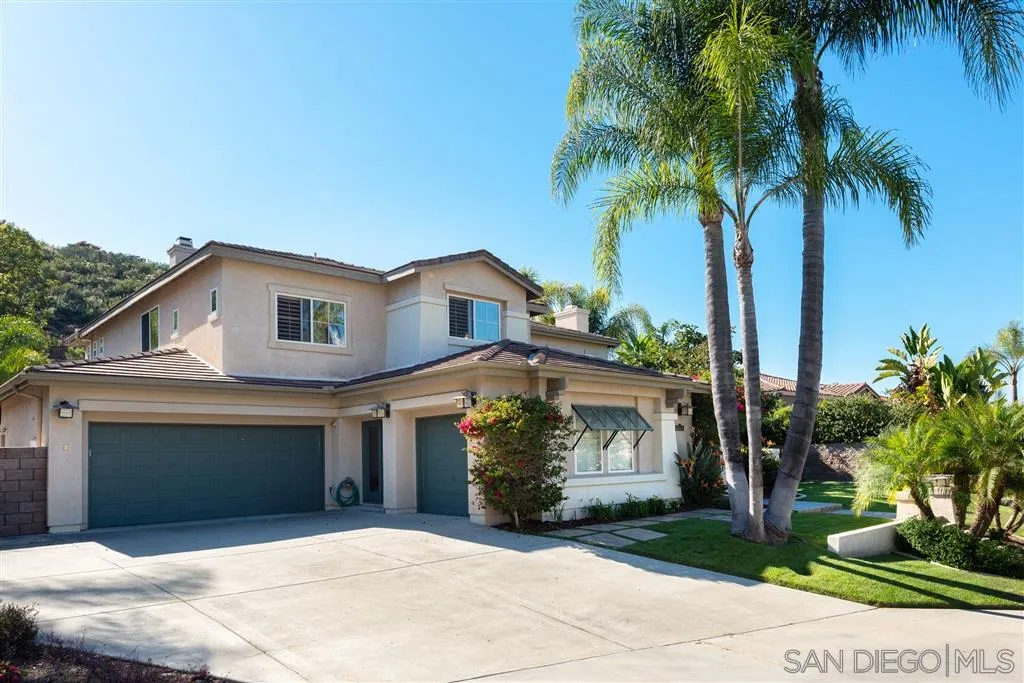 11692 Eastfield Road Poway, CA 92064 - Photo 25 of 25 a front view of a house with a yard and a garage