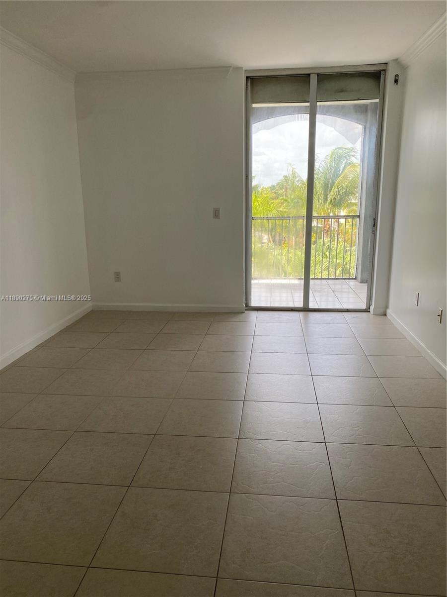 9725 Northwest 52nd Street, Unit 522 Doral, FL 33178 - Photo 2 of 17 a view of an empty room with a window