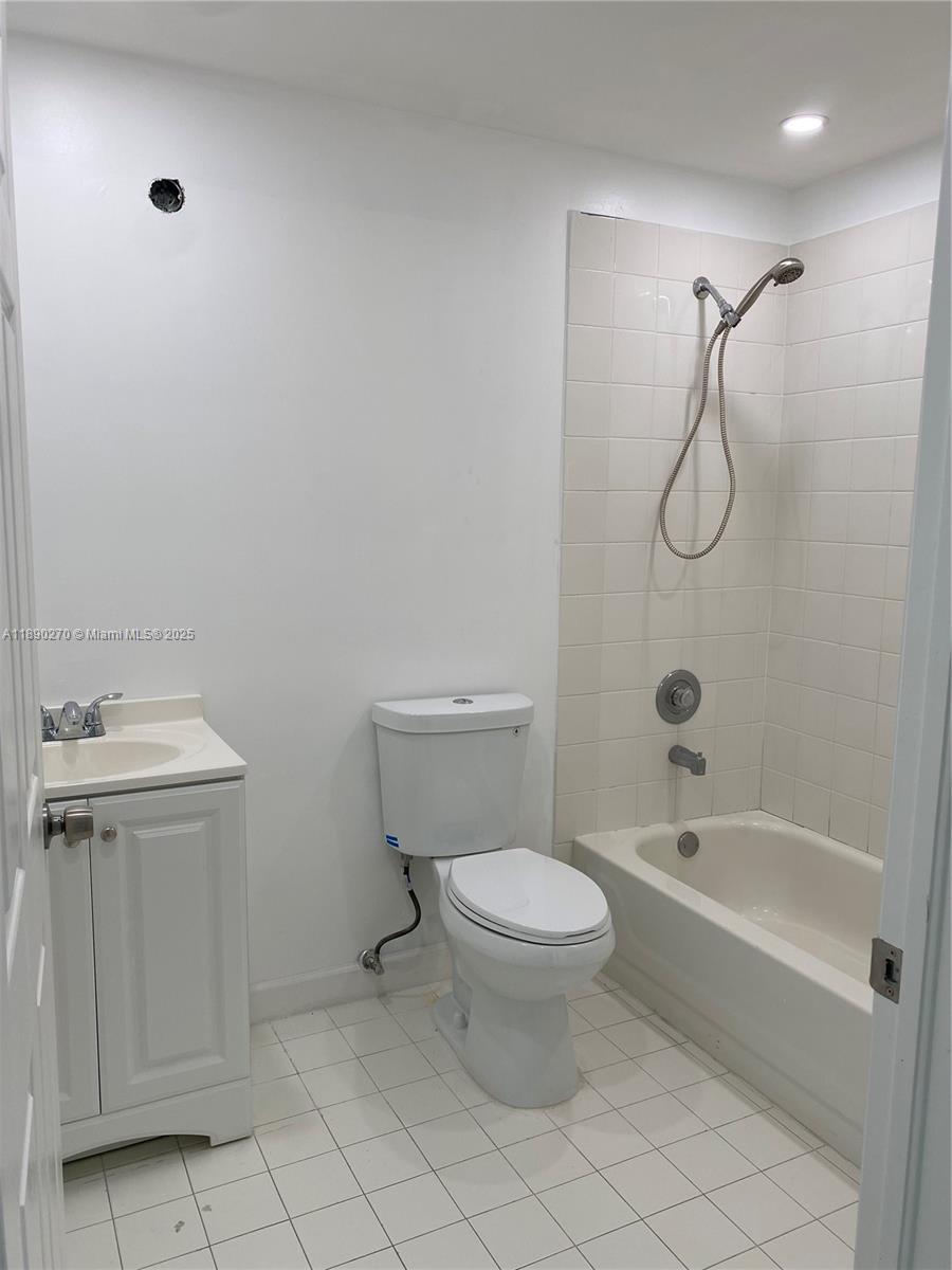 9725 Northwest 52nd Street, Unit 522 Doral, FL 33178 - Photo 6 of 17 a bathroom with a toilet sink and shower