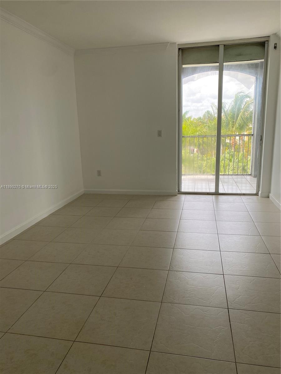9725 Northwest 52nd Street, Unit 522 Doral, FL 33178 - Photo 8 of 17 a view of an empty room and window