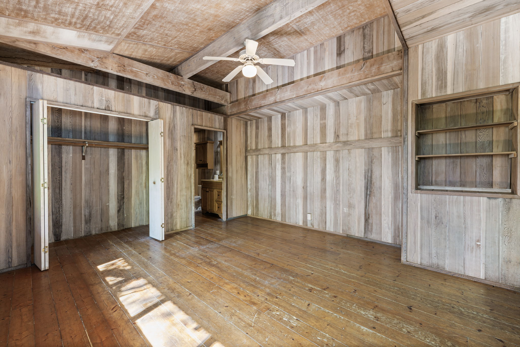 82-6284 Puuhonua Road Captain Cook, HI 96704 - Photo 16 of 30 a view of an empty room with wooden floor