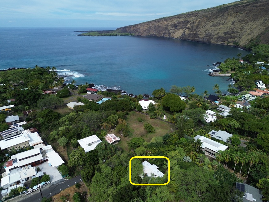 82-6284 Puuhonua Road Captain Cook, HI 96704 - Photo 28 of 30 a backyard of a house with lots of green space and a fountain
