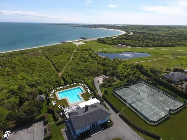 an aerial view of a house with a ocean view
