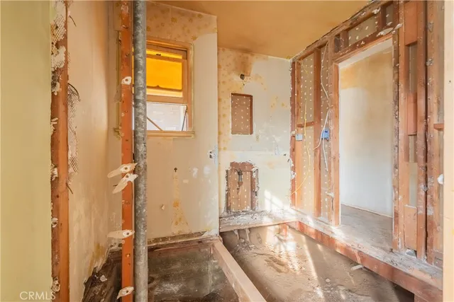 a view of a bathroom with a tub and shower