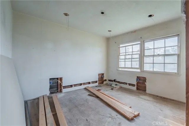 a room with a bed and a window