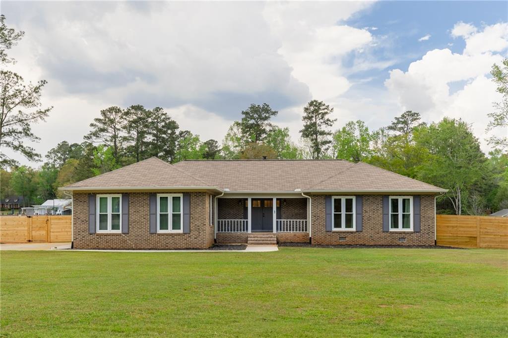 434 Rawley Road Americus, GA 31719 - Photo 2 of 50 a front view of a house with a garden