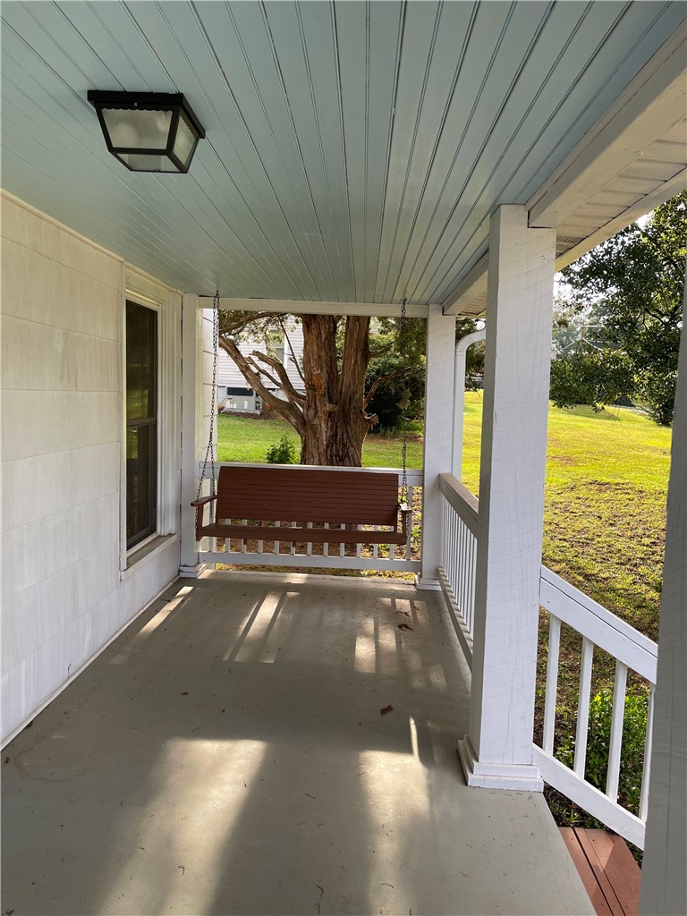 3 Wardlaw Street Pelzer, SC 29669 - Photo 7 of 8 Cool off, swing and sip sweet tea on the large front porch while enjoying the long summer shadow and light.