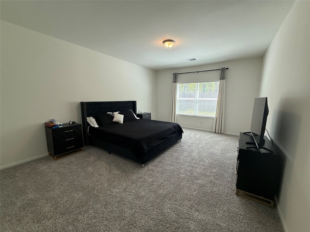 527 Baobab Way Crosby, TX 77532 - Photo 18 of 50 a living room with furniture and a flat screen tv