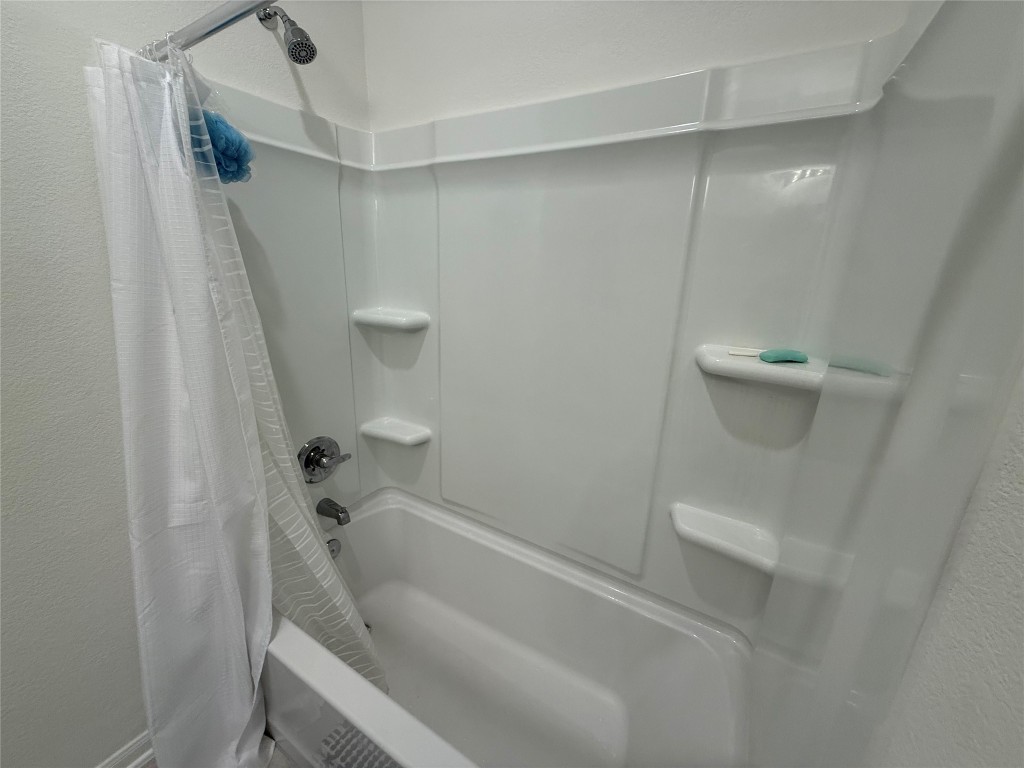 527 Baobab Way Crosby, TX 77532 - Photo 21 of 50 a bathroom with a tub and shower
