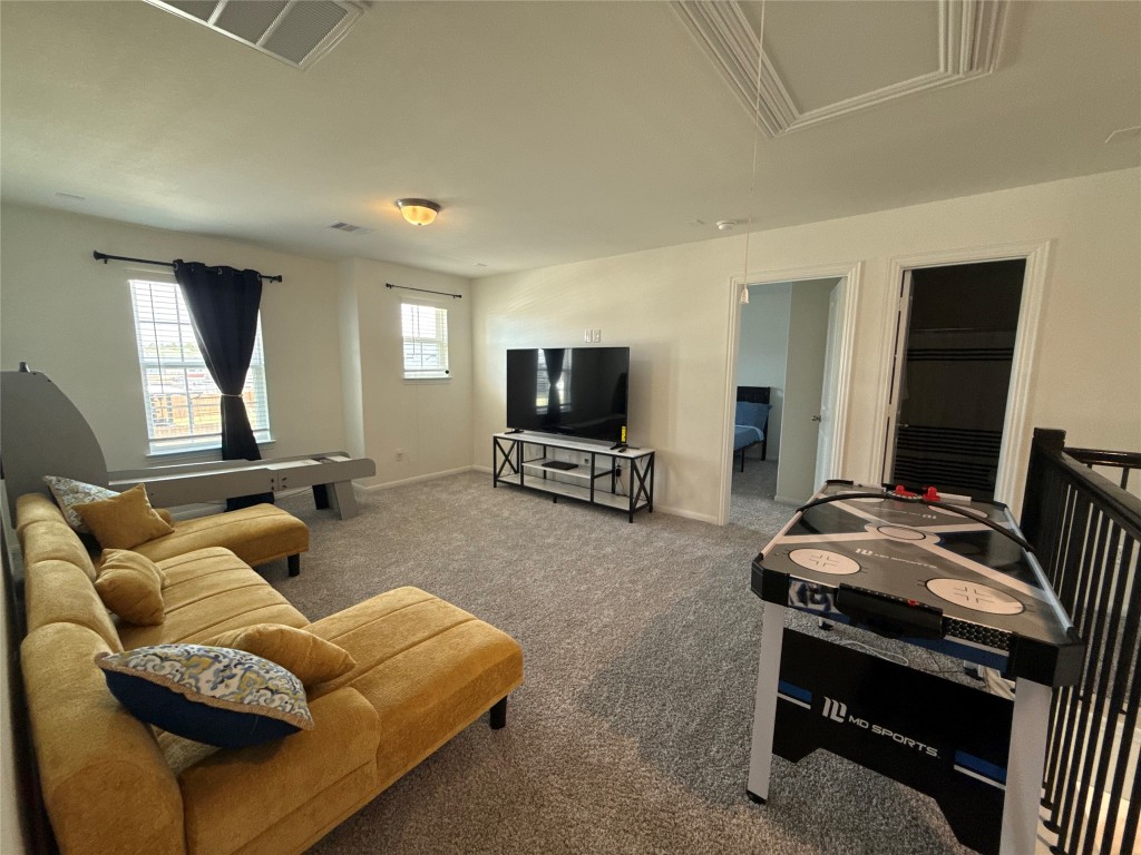 527 Baobab Way Crosby, TX 77532 - Photo 27 of 50 a living room with furniture and a flat screen tv
