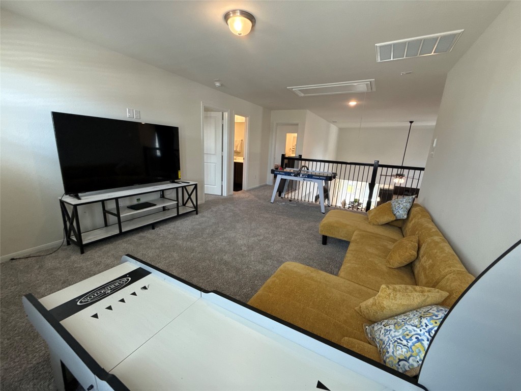 527 Baobab Way Crosby, TX 77532 - Photo 29 of 50 a living room with furniture and a flat screen tv