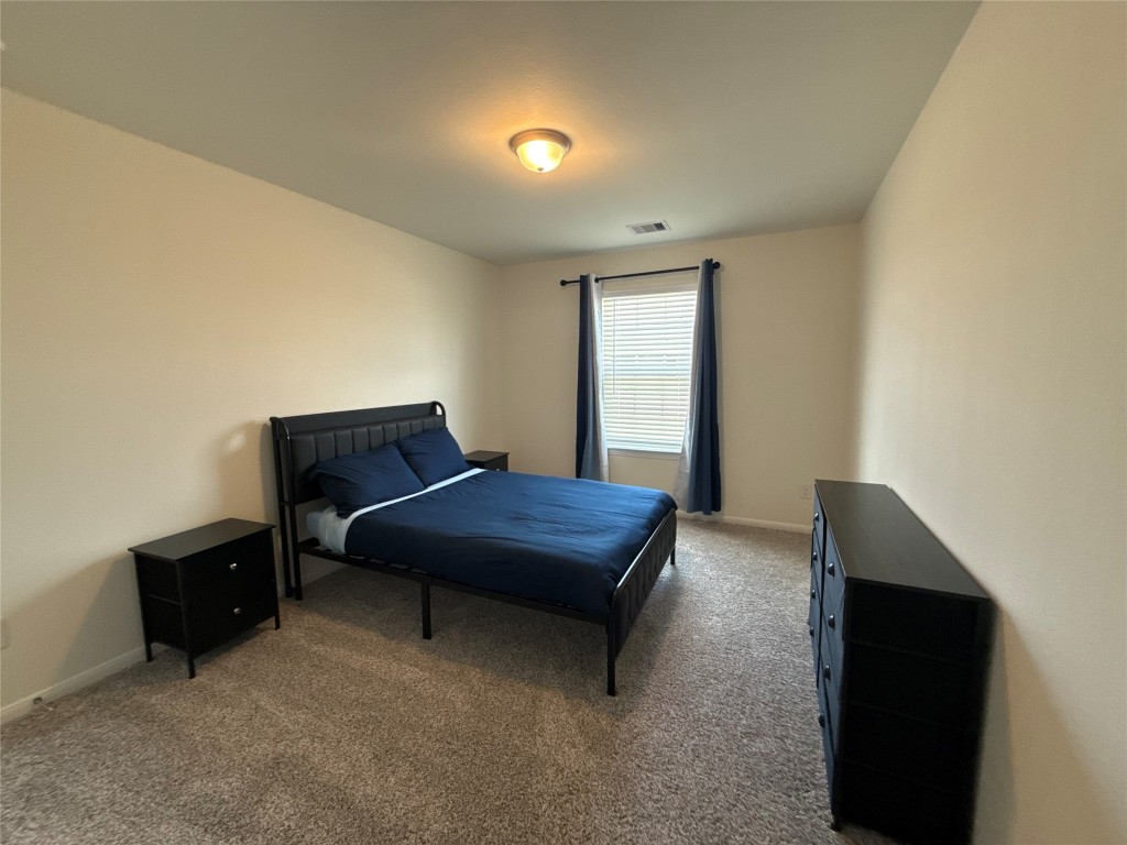 527 Baobab Way Crosby, TX 77532 - Photo 30 of 50 a room with a bed and a window