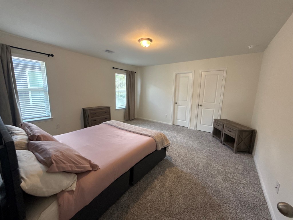 527 Baobab Way Crosby, TX 77532 - Photo 37 of 50 a bedroom with a bed and a couch