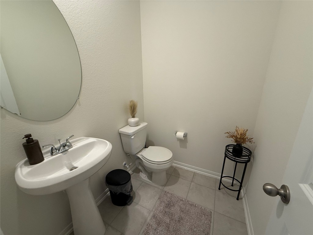 527 Baobab Way Crosby, TX 77532 - Photo 48 of 50 a bathroom with a toilet sink and mirror