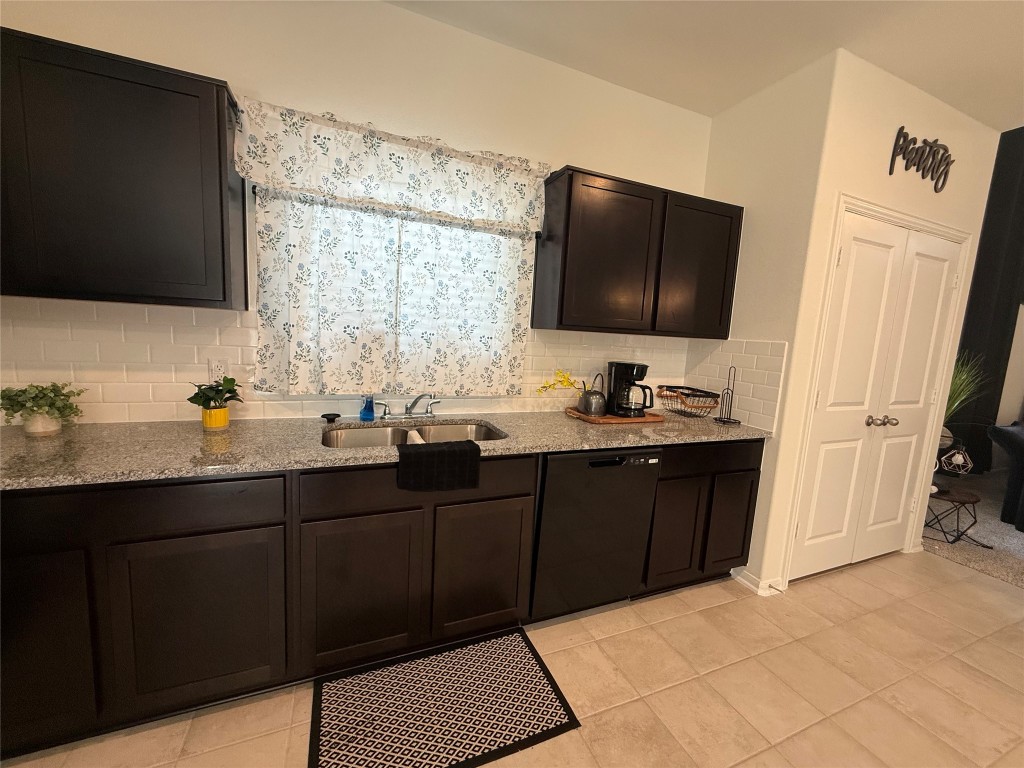 527 Baobab Way Crosby, TX 77532 - Photo 8 of 50 a bathroom with a double vanity sink and mirror