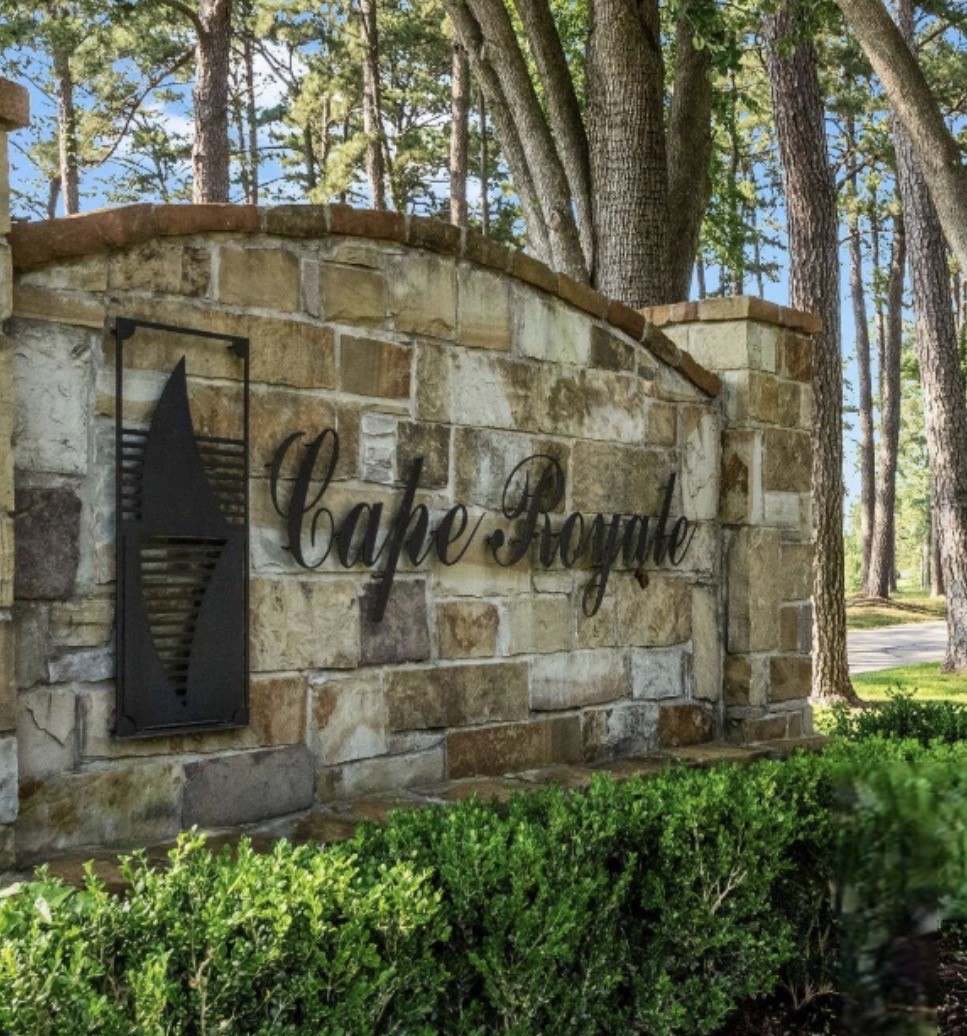 126 Green Tree Drive Coldspring, TX 77331 - Photo 2 of 6 a brick building with a yard