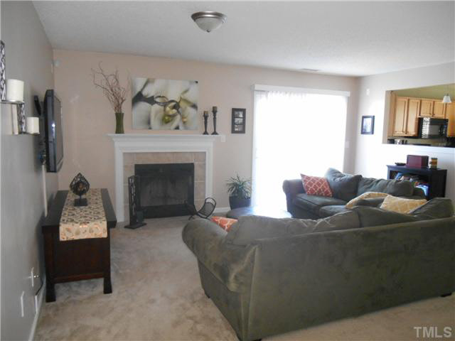 5012 Mocha Lane Raleigh, NC 27616 - Photo 6 of 14 a living room with furniture and a fireplace