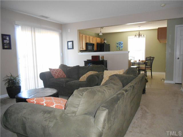 5012 Mocha Lane Raleigh, NC 27616 - Photo 7 of 14 a living room with furniture and a large window